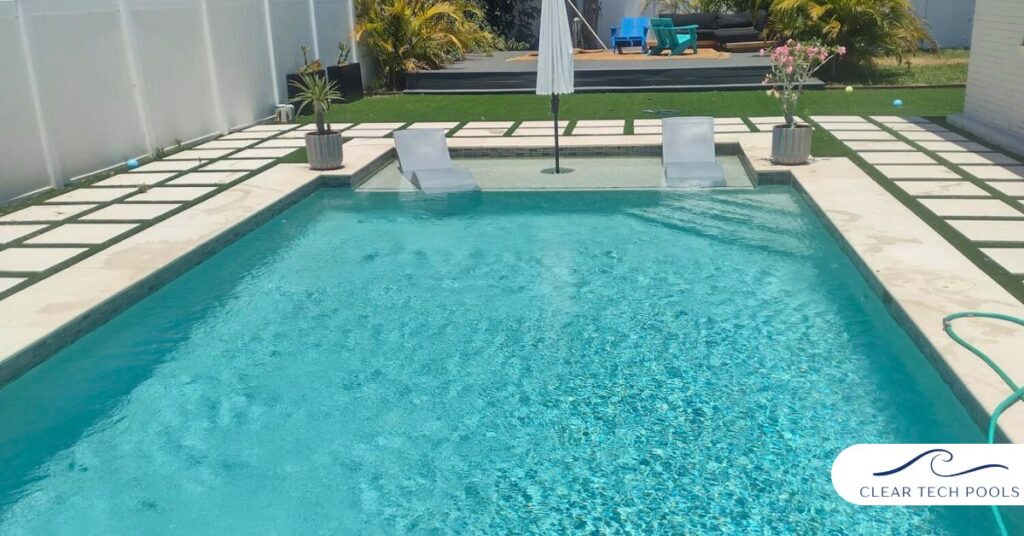 Modern residential swimming pool with clear blue water