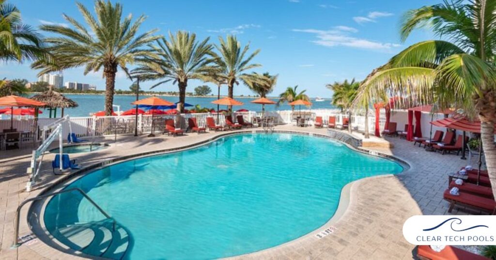 Resort-style swimming pool with palm trees